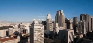 hero image uploaded, alt text: Daytime view of São Paulo’s downtown skyline with various high-rise buildings under a clear blue sky