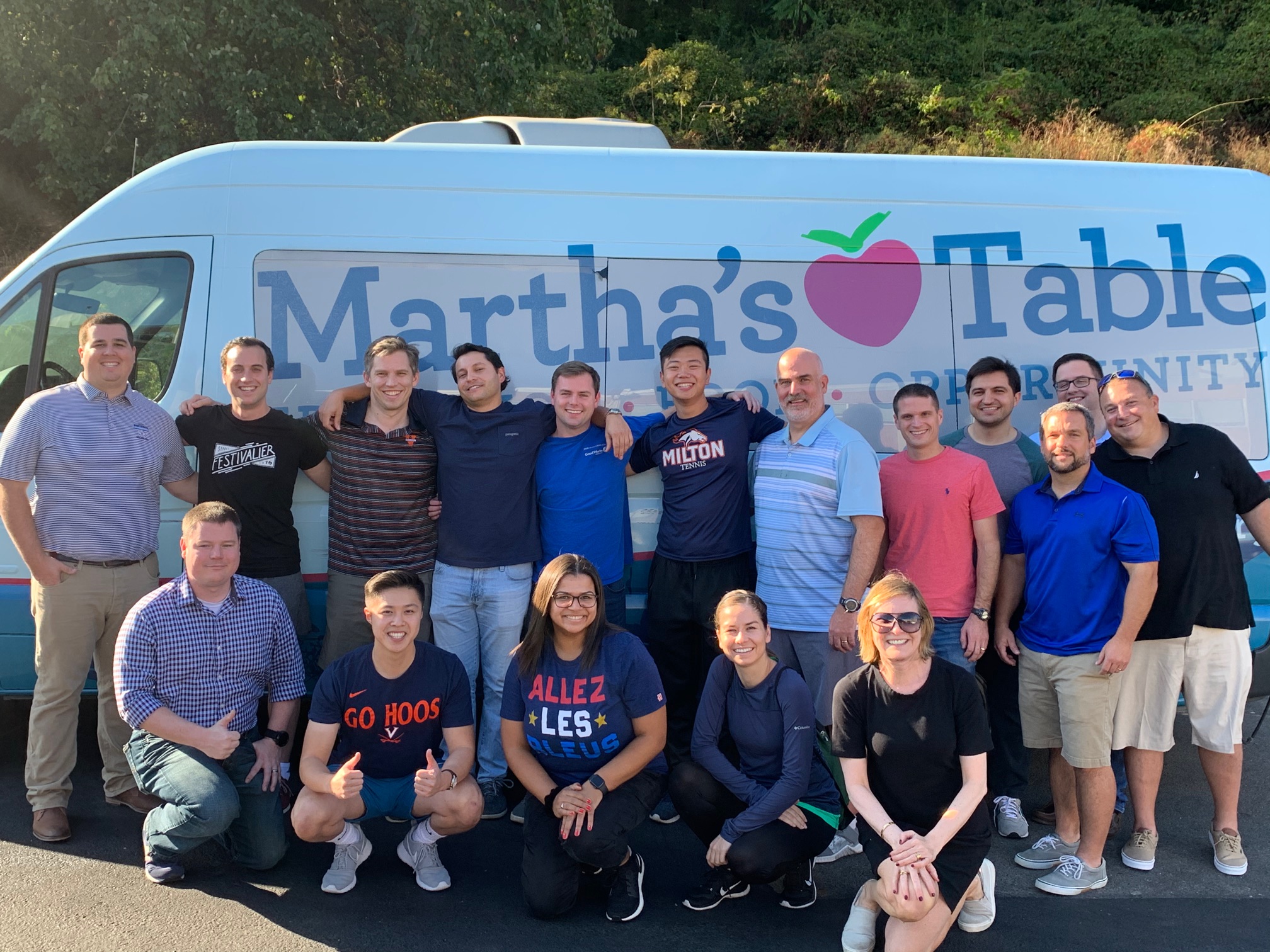 Photograph of J.P. Morgan employees standing in front of Martha's Table van.