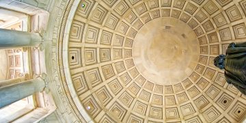A low-angle view of the classical dome ceiling inside the Jefferson Memorial.